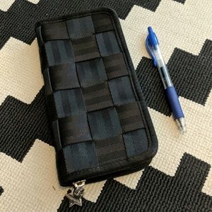 Harveys Seatbelt bag black woven clutch wallet